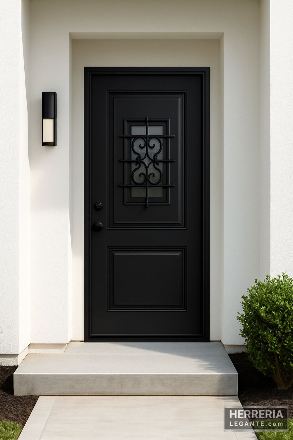 puerta de herrería negra con diseño forjado en fachada moderna minimalista
